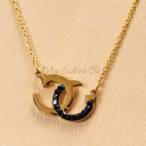 Chanel Black & Gold Logo Locket