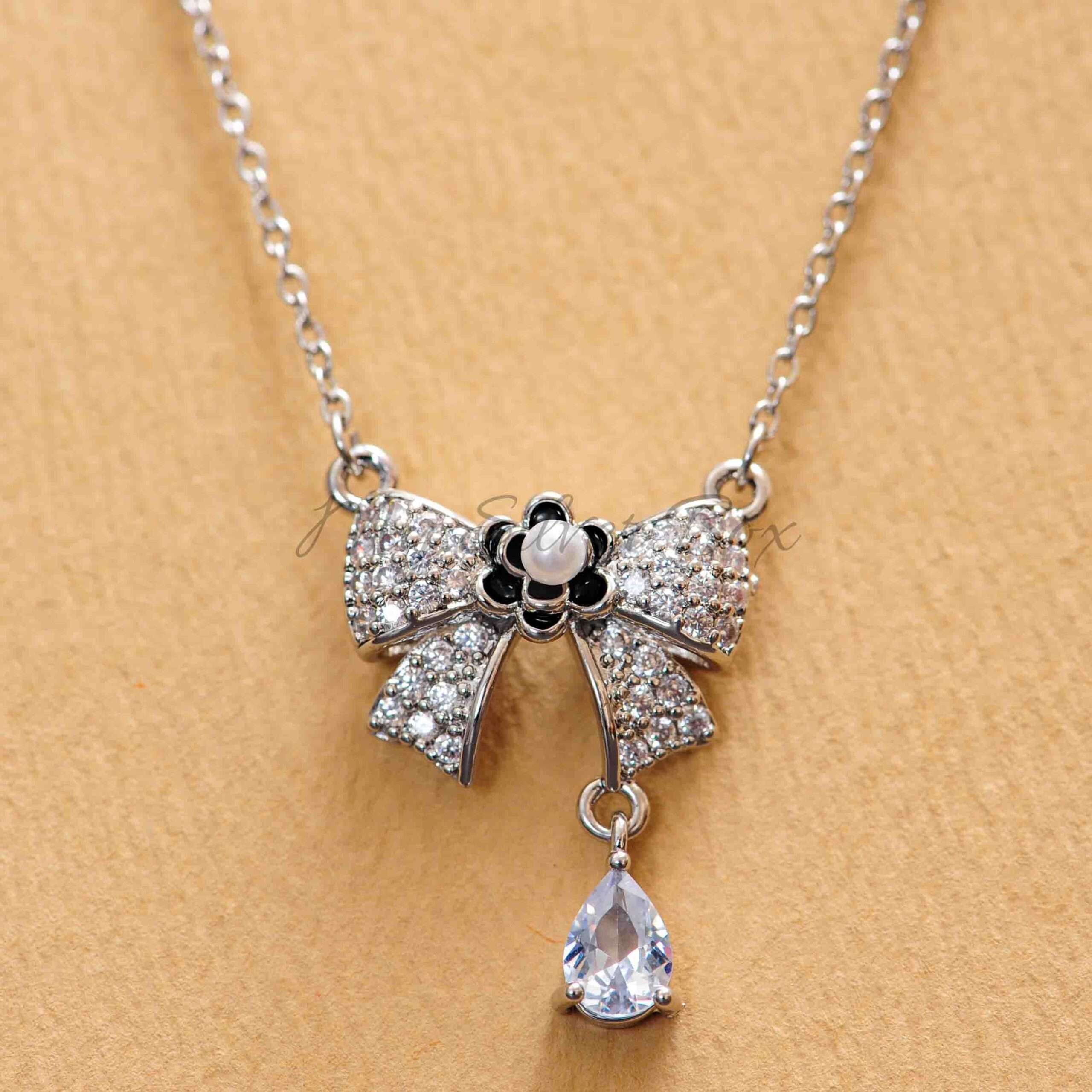 Black Flower Center Bow Locket